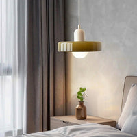 Modern Bauhaus LED pendant light in a minimalist master bedroom with neutral decor