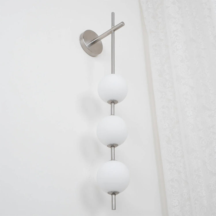 Stilfuld sfærisk glasvæglampe